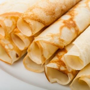 Rolled crepes on a plate